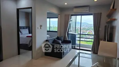 Modern living room with mountain view and balcony access in stylish apartment