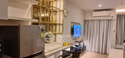 Modern living room with sleek design and stainless steel appliances