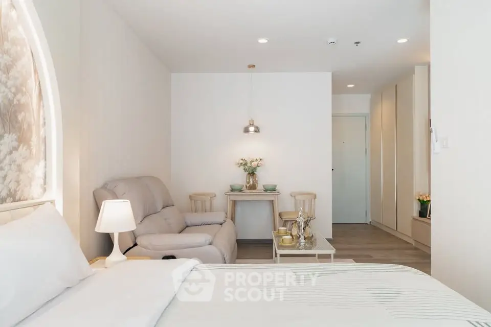 Modern studio apartment with cozy living area and elegant decor