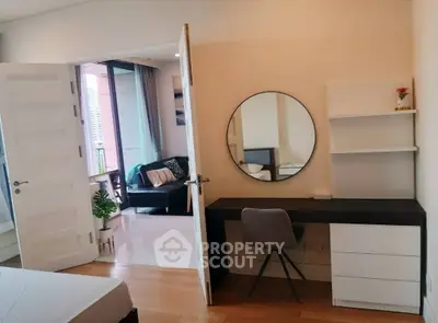 Modern bedroom with study area and balcony view in stylish apartment