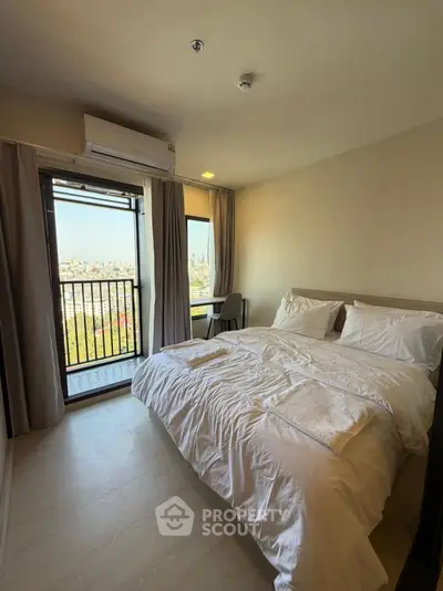 Modern bedroom with balcony view in high-rise apartment