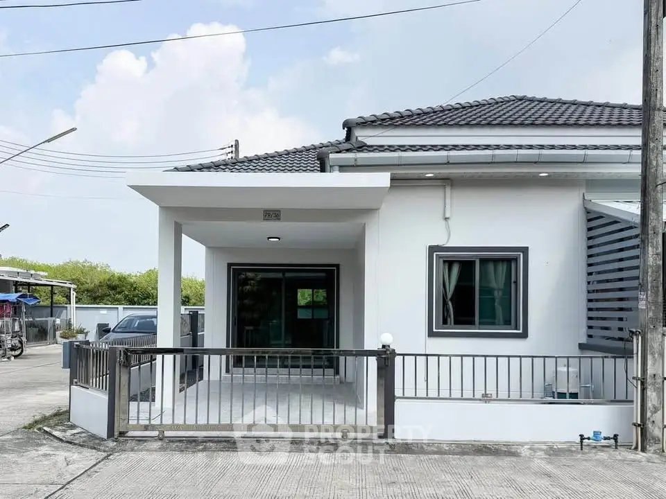 Charming single-story house with modern design and spacious front patio, perfect for family living.