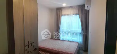 Cozy bedroom with natural light and modern decor