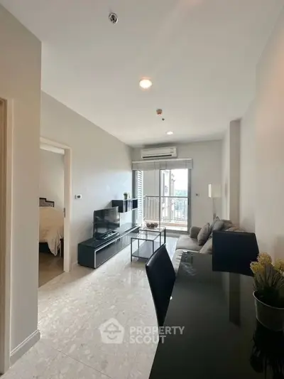 Modern living room with sleek design and balcony access