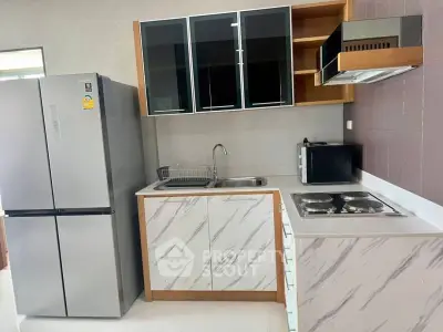 Modern kitchen with sleek appliances and stylish cabinetry