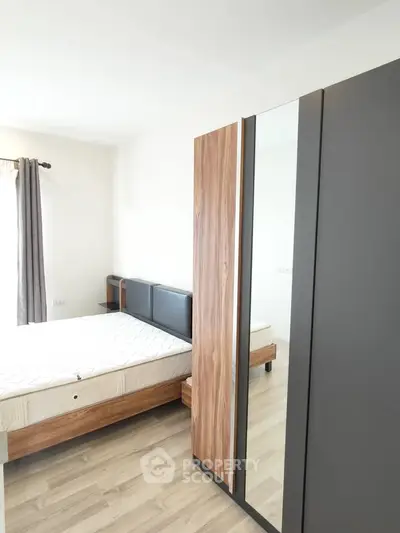 Modern bedroom with wooden furniture and natural light