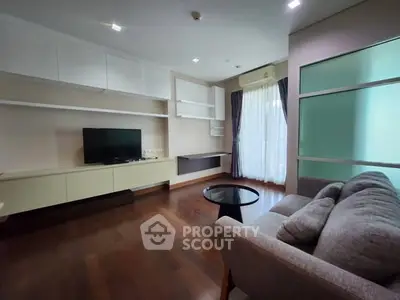 Spacious living room with modern furnishings and natural light