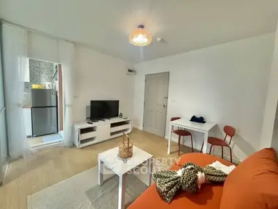 Cozy living room with modern decor and open kitchen layout