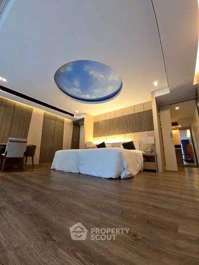 Luxurious bedroom with unique ceiling design and elegant wooden flooring