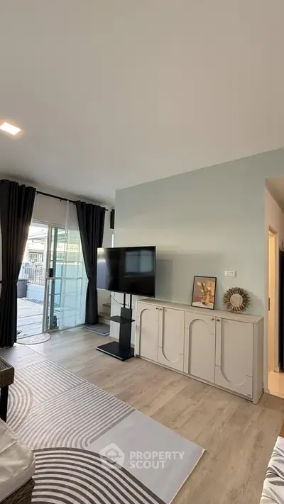 Modern living room with sleek TV setup and stylish decor