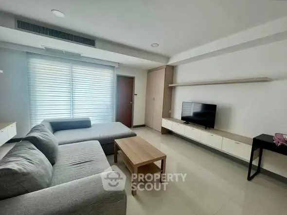 Modern living room with sleek furniture and natural light