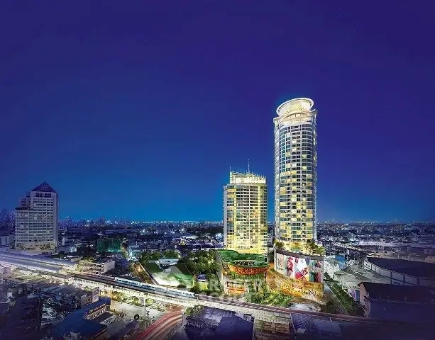 Stunning night view of modern high-rise buildings with vibrant cityscape backdrop, perfect for luxury urban living.