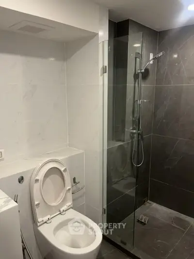 Modern bathroom with sleek glass shower and elegant tile design
