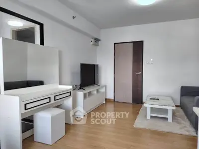 Modern living room with sleek furniture and wooden flooring