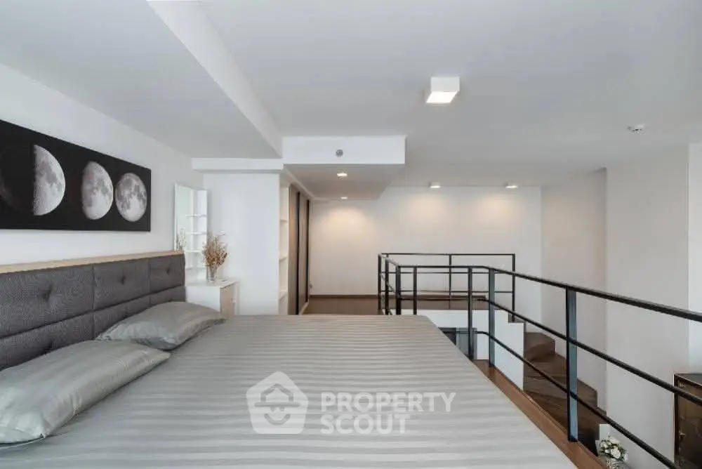 Modern loft bedroom with stylish decor and mezzanine level