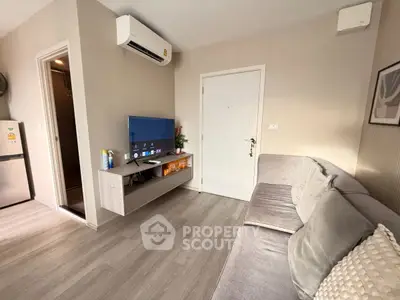 Modern living room with sleek furniture and air conditioning unit