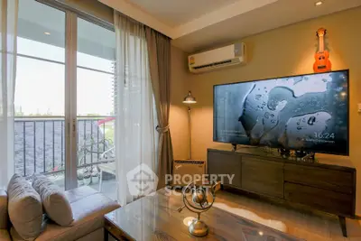 Modern living room with large TV and balcony view in stylish apartment