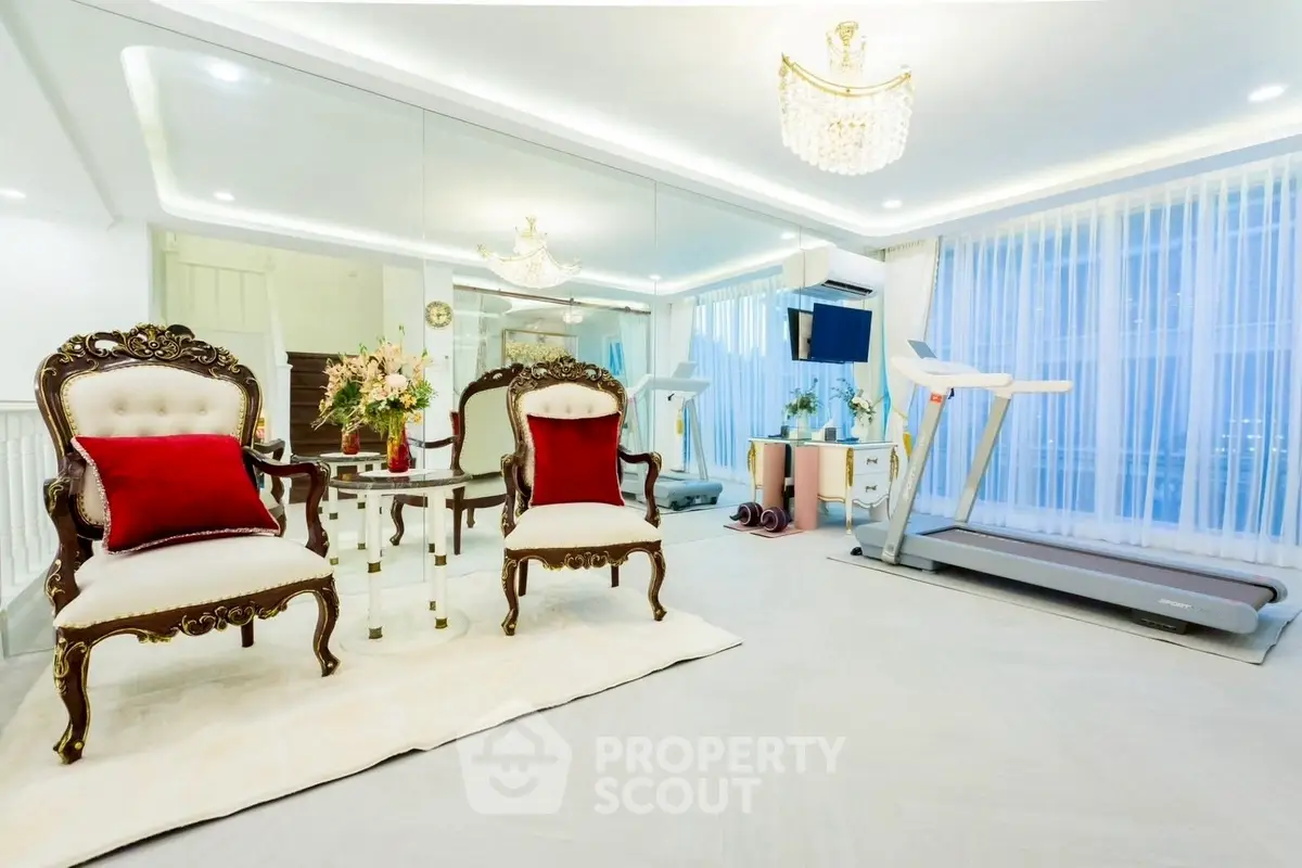 Luxurious home gym with elegant seating and treadmill, perfect for fitness enthusiasts.