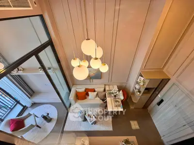 Luxurious modern living room with elegant lighting and stylish decor, perfect for urban living.