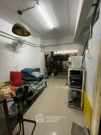 Cozy living area with minimalist decor and ample storage space.