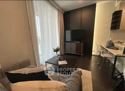 Modern living room with cozy sofa and sleek TV setup, perfect for relaxation.