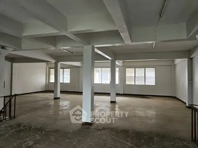 Spacious open-plan interior ideal for office or studio space with ample natural light.