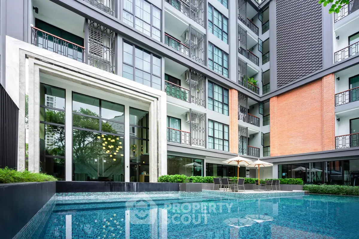 Modern apartment building with luxurious pool and stylish architecture