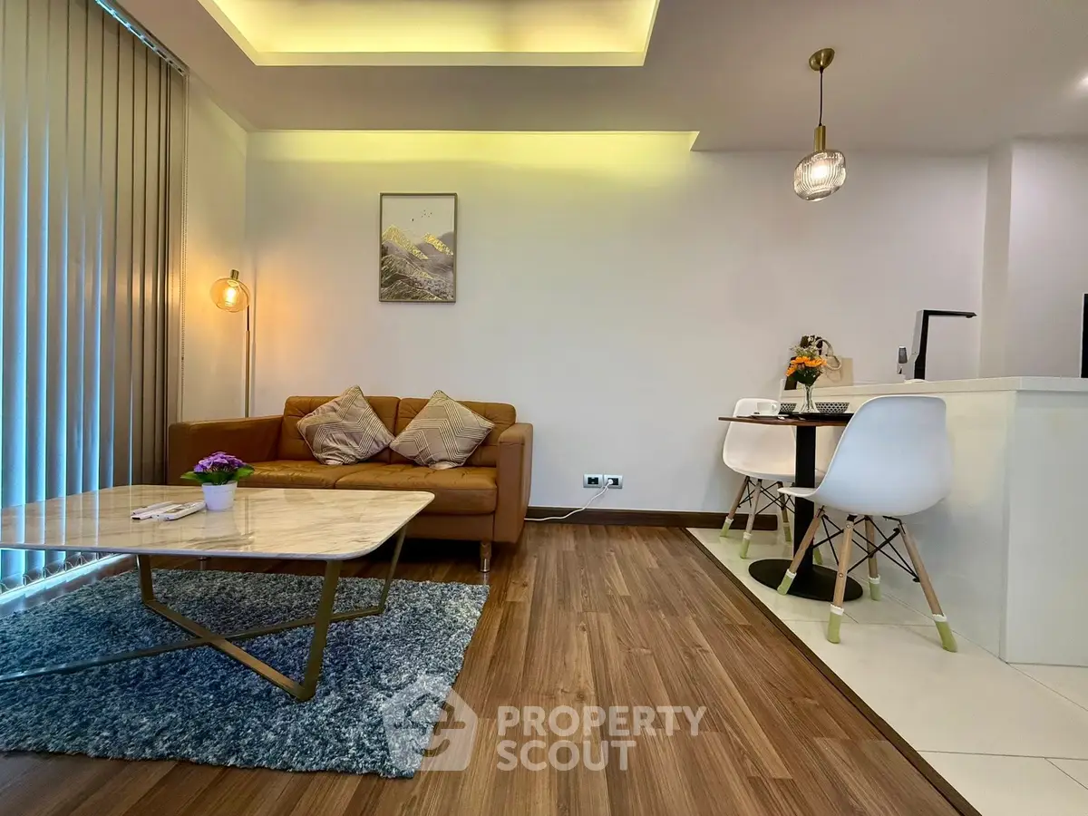 Modern living room with stylish decor and open dining area