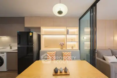 Modern living room with stylish decor and open kitchen layout