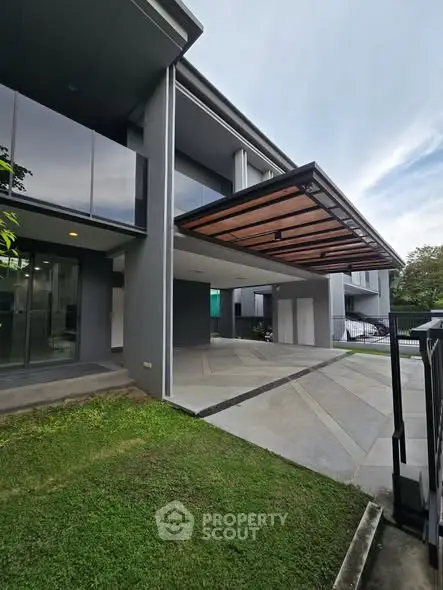 Modern building exterior with sleek design and spacious driveway