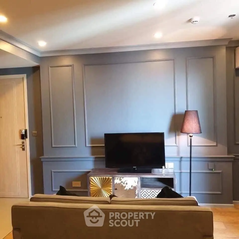 Stylish living room with modern decor and TV setup, perfect for relaxation and entertainment.