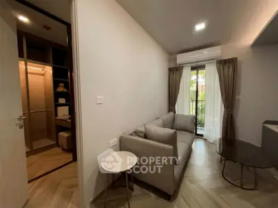 Modern living room with cozy sofa and balcony view