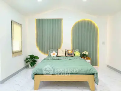 Modern bedroom with stylish decor and ambient lighting, featuring a cozy bed and elegant wall design.