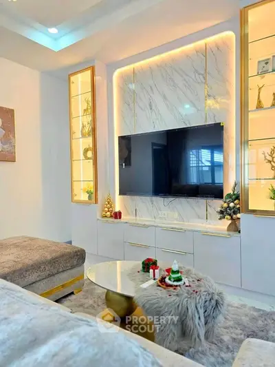 Luxurious living room with modern decor, marble accents, and ambient lighting.