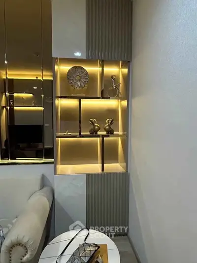 Modern living room with stylish illuminated shelving and elegant decor accents.