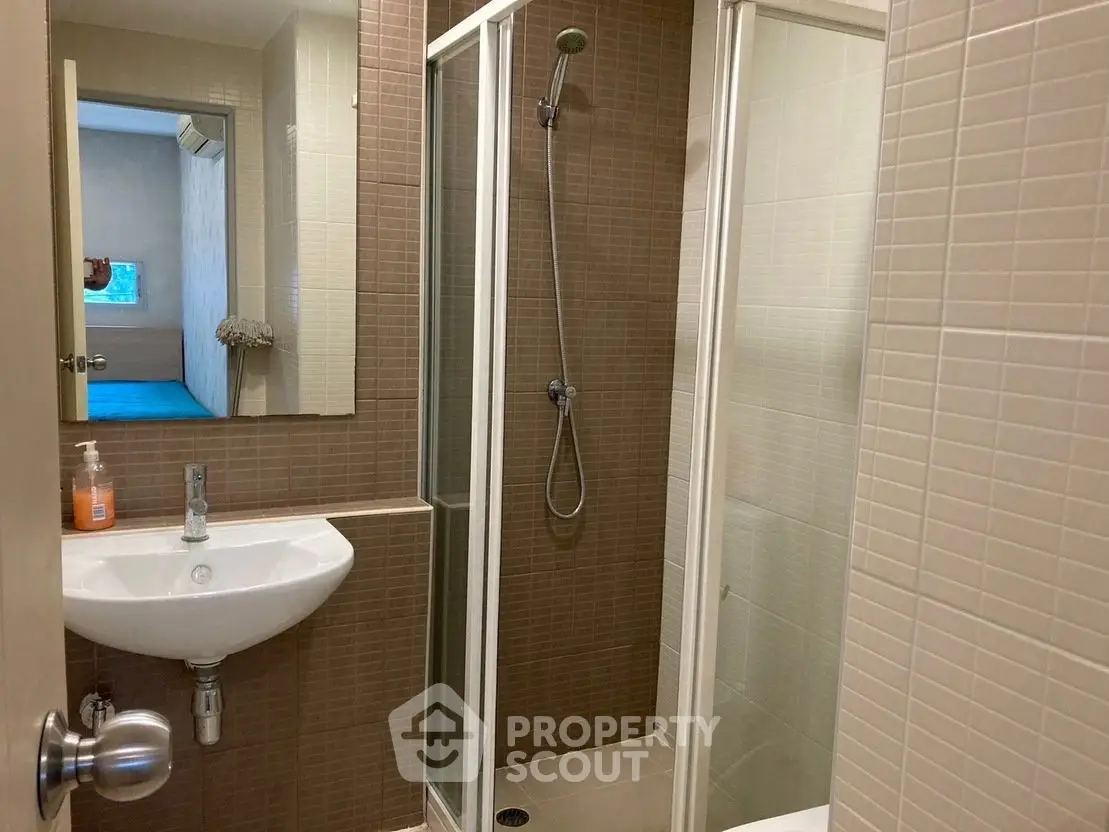 Modern bathroom with glass shower and sleek sink design