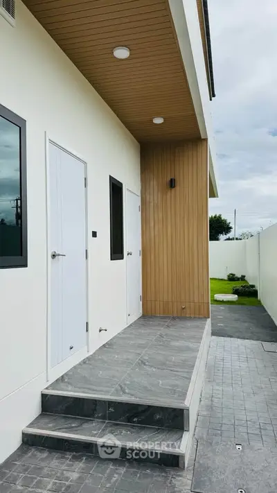 Modern minimalist exterior with wooden accents and sleek design