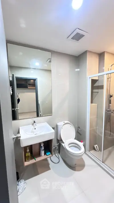 Modern bathroom with sleek design and glass shower enclosure