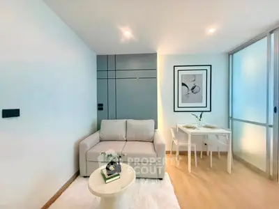 Modern living room with cozy sofa and dining area in a stylish apartment.