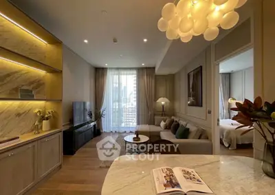 Luxurious modern living room with elegant decor and open layout, featuring a cozy seating area and stylish lighting.