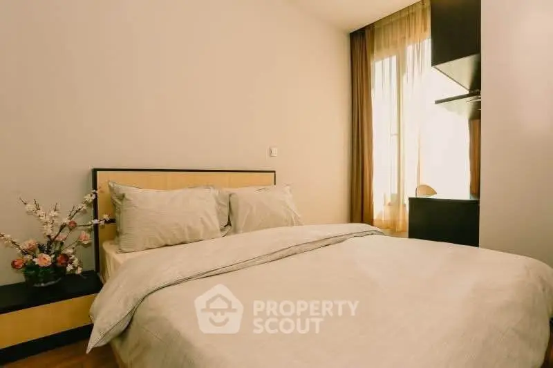 Cozy bedroom with natural light and elegant decor