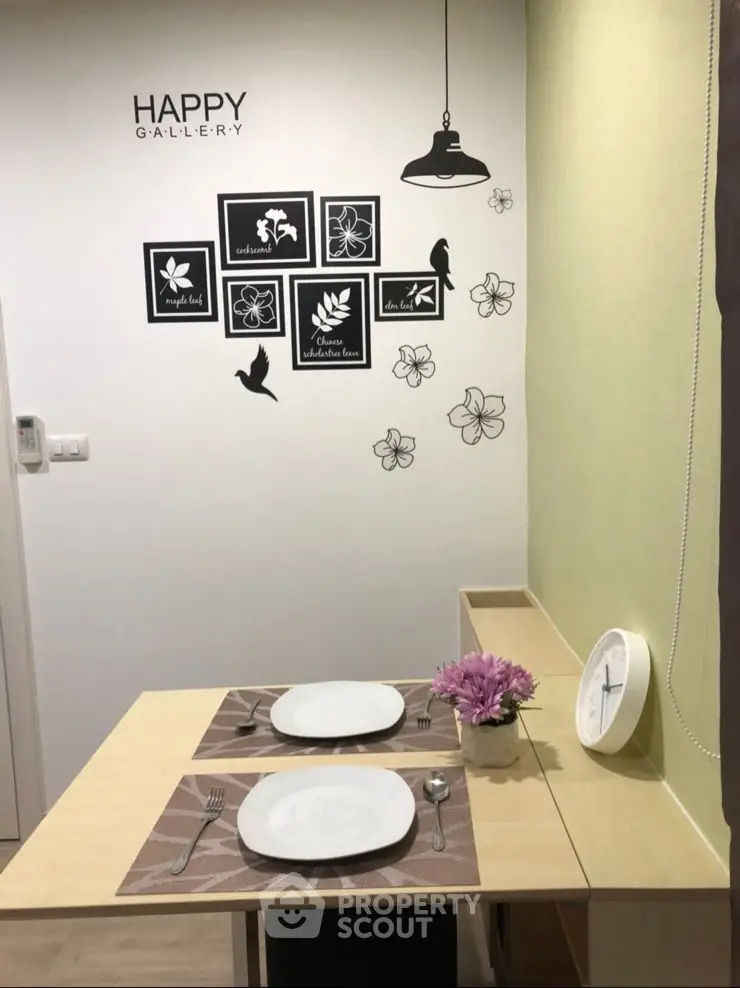Charming dining nook with stylish wall art and cozy table setting
