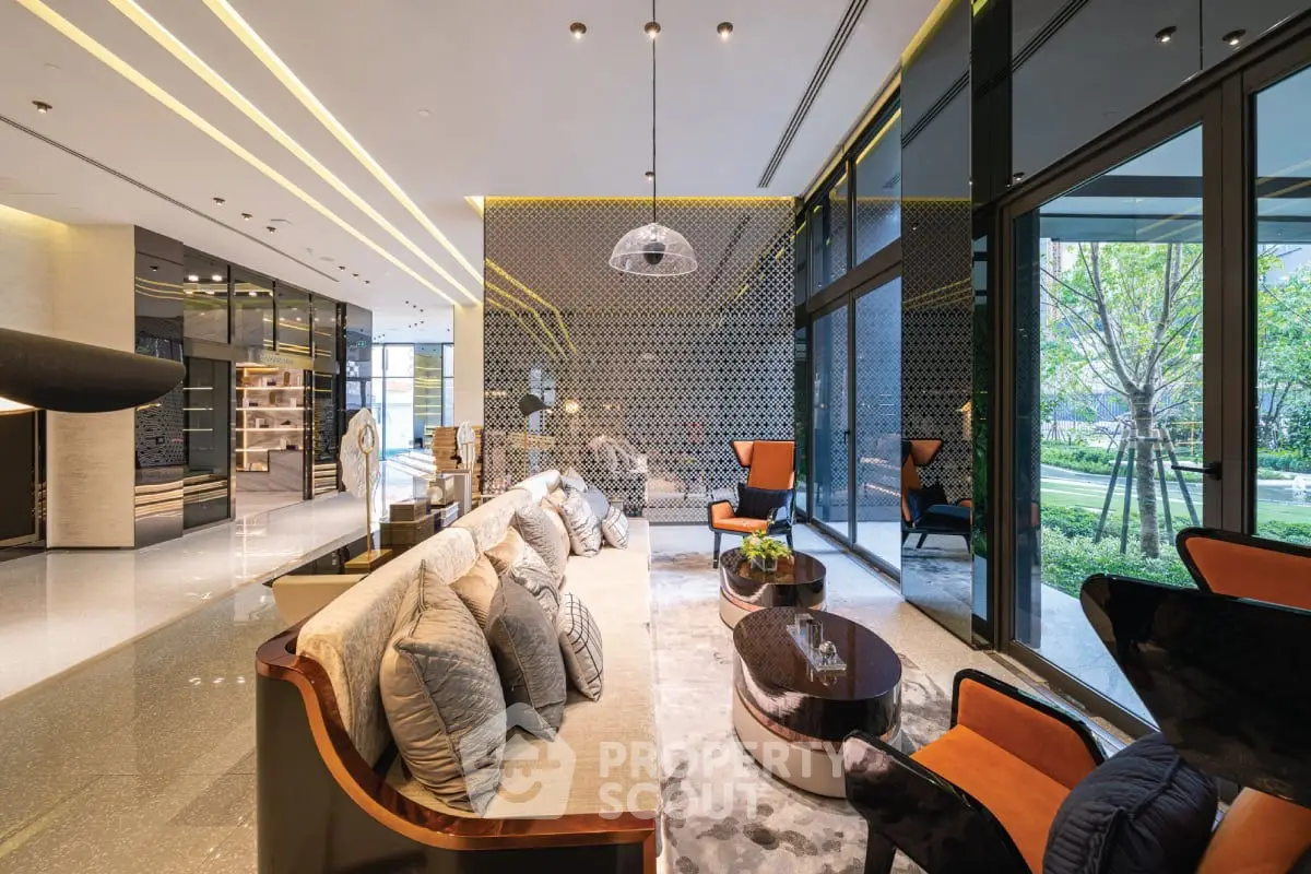 Luxurious modern living room with elegant decor and large windows overlooking a lush garden.