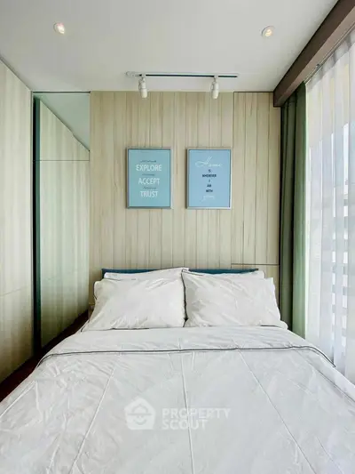 Modern bedroom with stylish decor and natural light