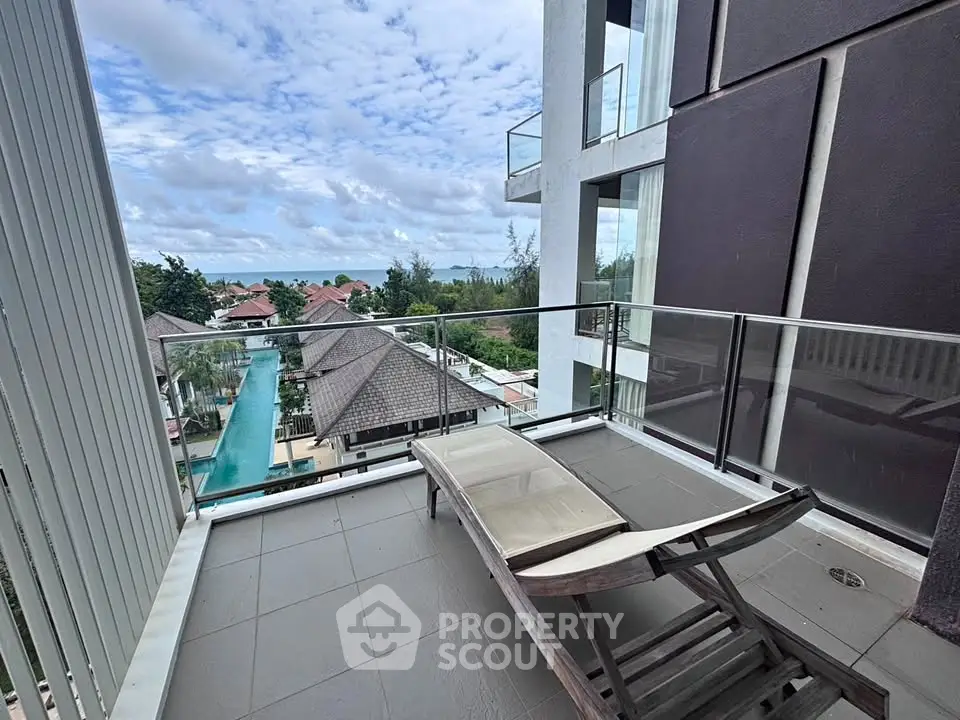 Luxurious balcony with stunning ocean view in modern high-rise building