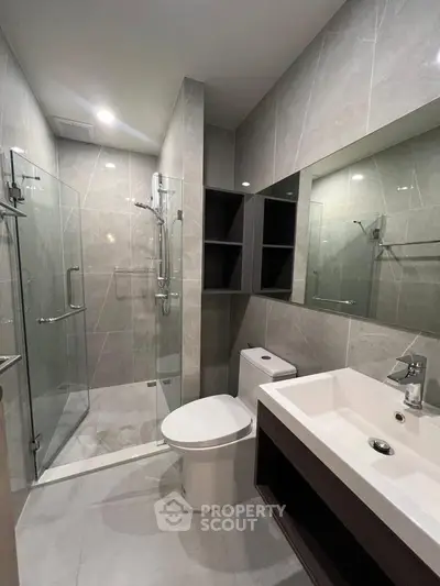 Modern bathroom with sleek design and glass shower enclosure