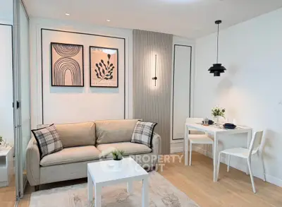 Modern living room with stylish decor and cozy dining area, perfect for urban living.