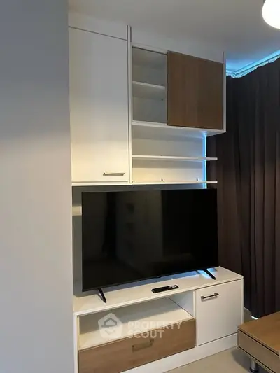 Modern living room with sleek TV unit and stylish storage cabinets