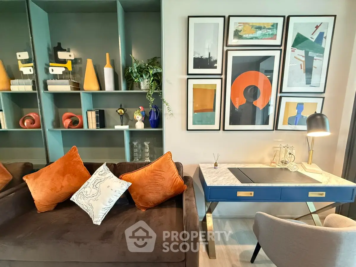 Stylish living room with modern art and cozy seating, perfect for relaxation and inspiration.