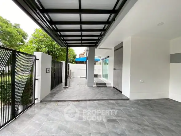 Modern home exterior with sleek carport and stylish tiled flooring